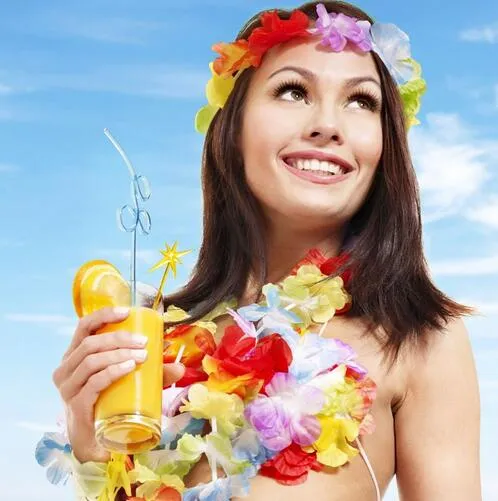 A beach scene with people playing with beach toys