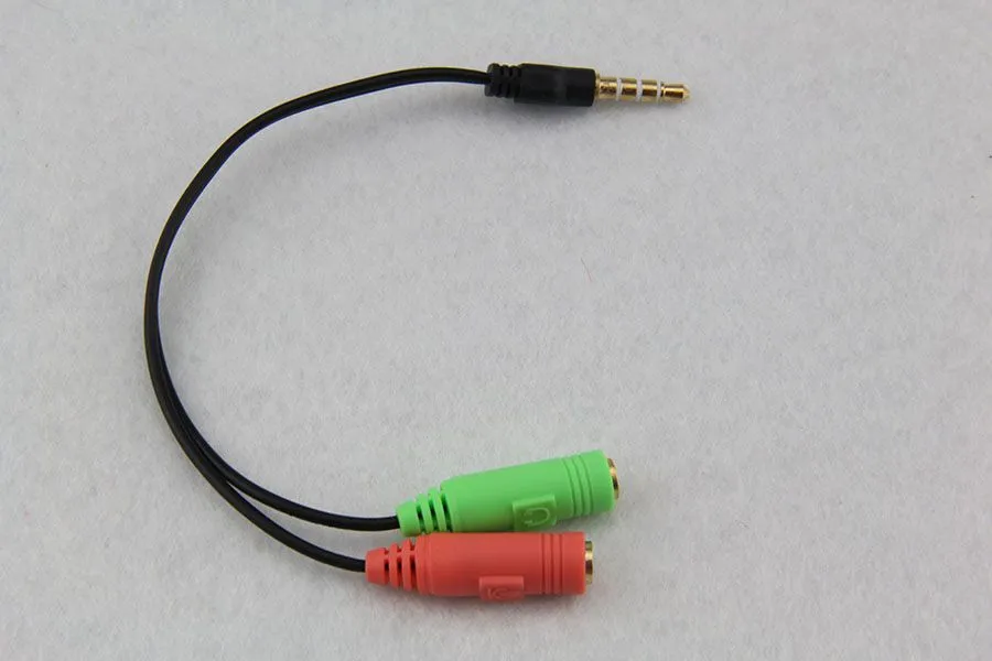 2 à 1 adaptateur de câble audio tête de conversion de ligne en deux casque de téléphone portable ordinateur lecteur mp3 boîte de jeu microphone tourner 300 pcs/lot