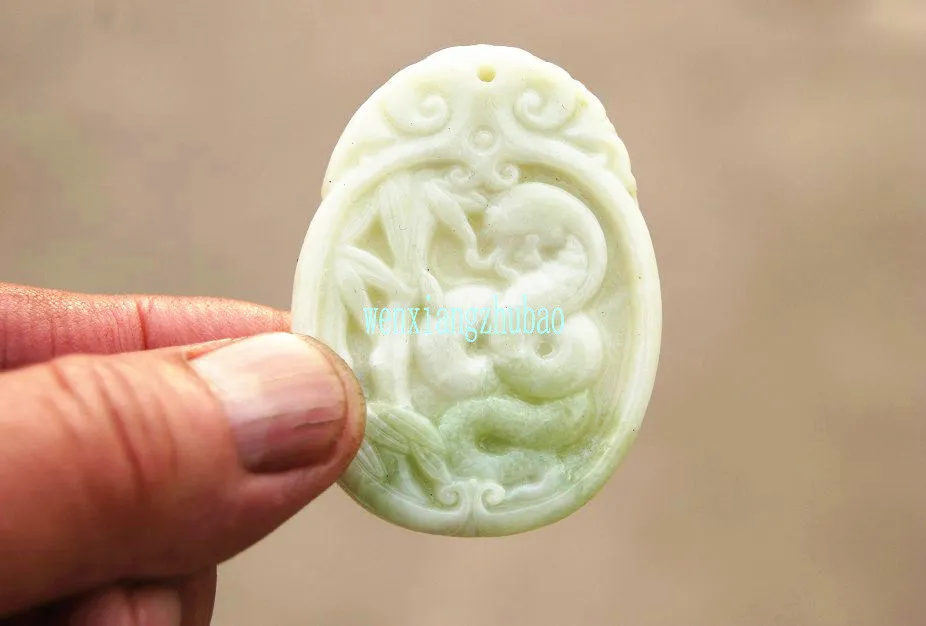 The natural white jade that is carved by hand. Silver snake dish bamboo rising up. Talisman necklace pendant