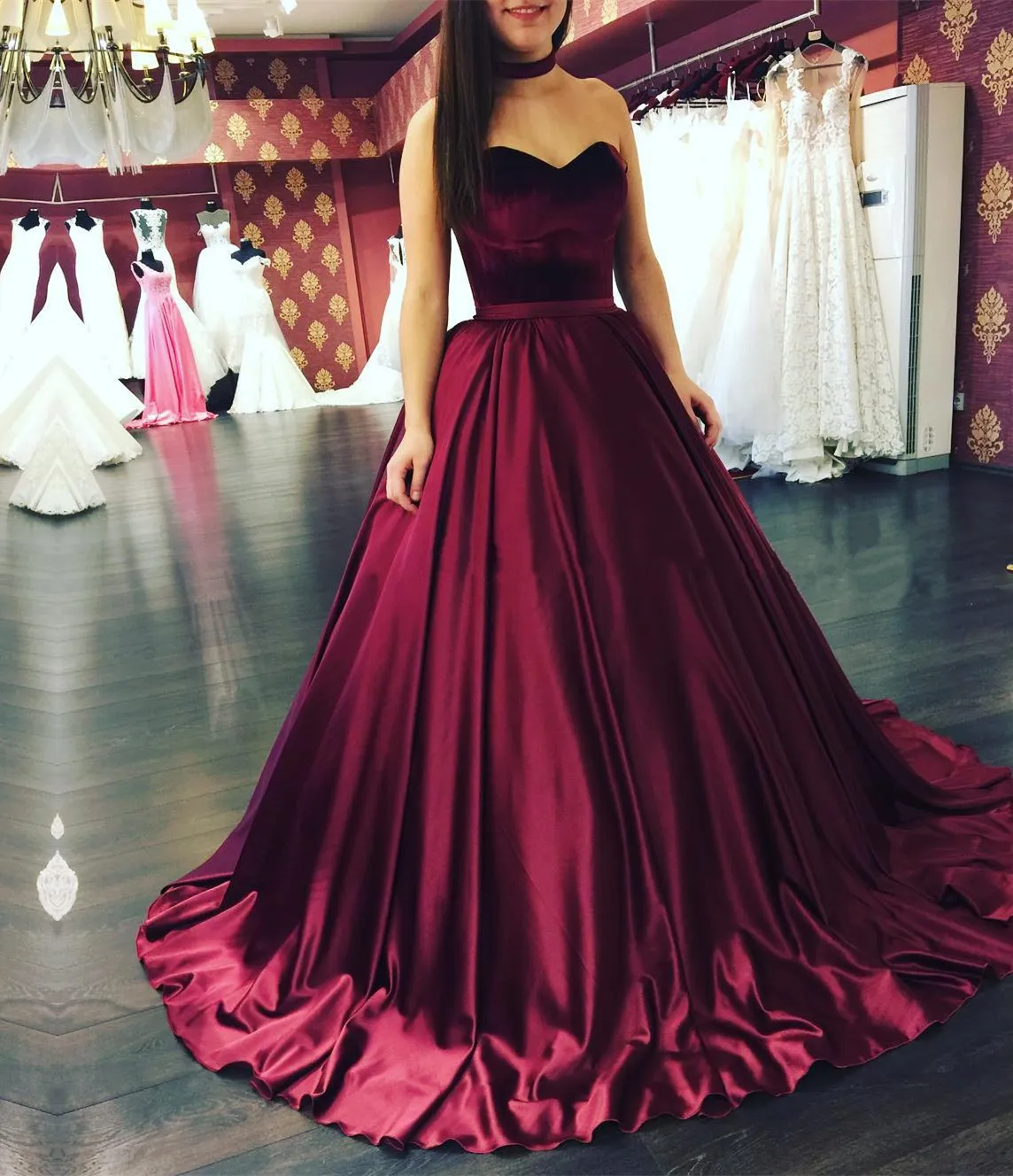 Women's exciting maroon evening gown with side slit skirt and royal  rhinestone bodice