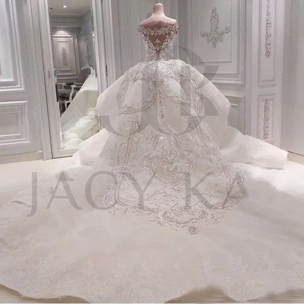 Luxury Crystal Bröllopsklänningar Dubai Mermaid Sparkly Plus Storlek Bröllopklänningar Sweetheart Off Shoulder Beaded Appliques Avtagbart tåg