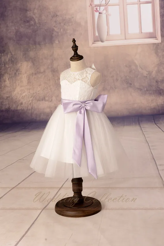 white flower girl dress with purple bow Flower Girl Dress Guide: Styles, Lengths & Occasions