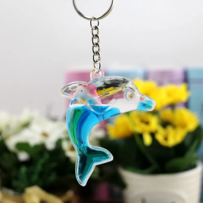 Dolphins floating bag pendant oil leak cartoon small gift creative key ring key ring aquarium gift KR349 Keychains a 