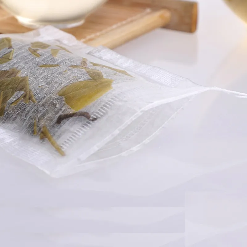 sachets à thé vides fibre de maïs de qualité alimentaire fait filtre unique cordon sachets de thé PLA fibre jetable infuseur de thé 6 * 8 cm prix pas cher