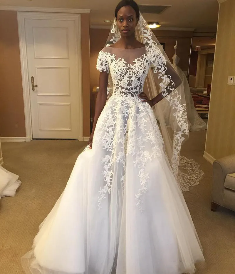 Abiti da sposa africani a collo nudo 2018 Appliques di pizzo Vedi attraverso abiti da sposa Una linea Tulle Lunghezza del pavimento Abiti da sposa economici