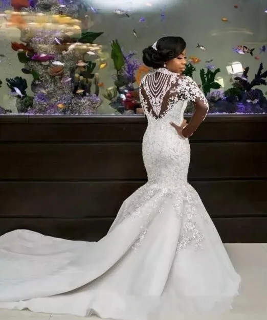 2022 Abiti da sposa a sirena africana di lusso Maniche lunghe Collo alto Illusion Appliques in pizzo Perline di cristallo Sheer Plus Size Abiti da sposa personalizzati