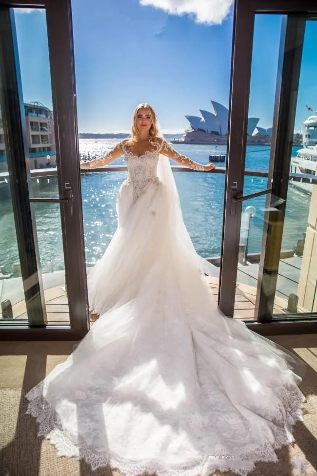 2020 Arabskie Luksusowe Suknie ślubne Syrenka Koronki Pearl Frezowanie Iluzja Długie Rękawy Overtkirts Suknie Ślubne Bridal Sukienka Zdejmowany pociąg