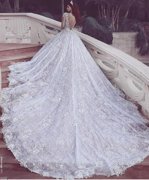 Lusso costoso 2016 Abiti da sposa vintage Sexy Sheer Bling Perline di cristallo Applique in pizzo Gioiello Manica lunga Illusion Abiti da sposa senza schienale