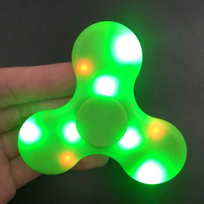 Hot Spinner Toy + Bluetooth Speaker Spinner LED Flash Light Hand Spinner Tri Cube Fluorescerande barn Vuxen gyroskopfinger med paket