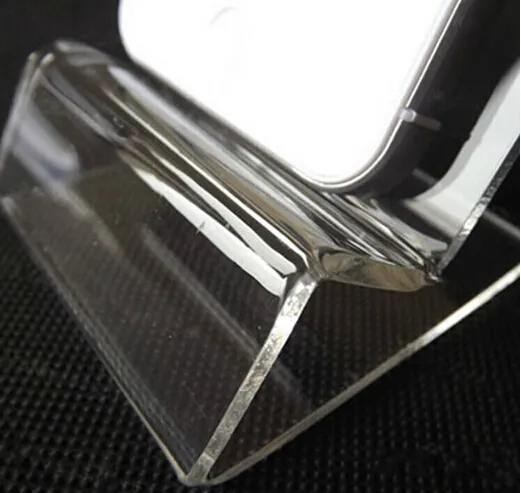Se muestra el soporte de exhibición del soporte de montaje de acrílico transparente transparente general universal para el teléfono móvil iphone Samsung
