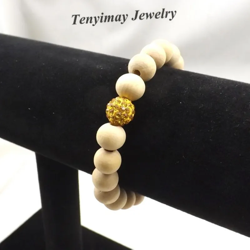 Elastisches ursprüngliches Farben-hölzernes Perlen-Armband mit 10mm Goldfarben-Kristall-Korn für Frauen Satz von 