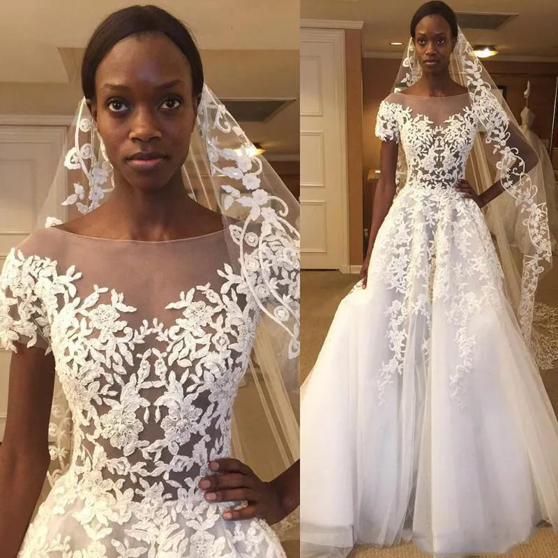 Vestidos de novia de cuello transparente africano 2018 Apliques de encaje Vestidos de novia transparentes Una línea de tul hasta el suelo Vestidos de boda baratos