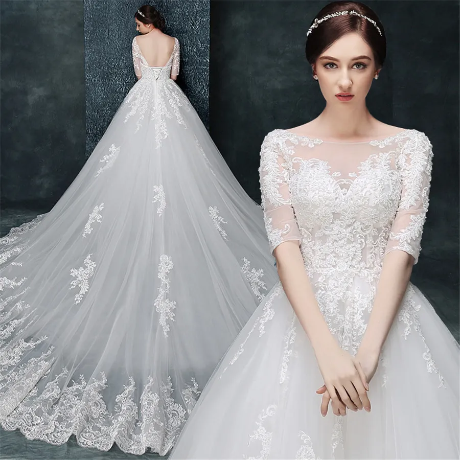 Scoop Deckline половина рукава Высококачественная кружевная аппликация Смотреть сквозь свадебные платья Бальные платья Royal Train Bridal Платья Vestido Curto
