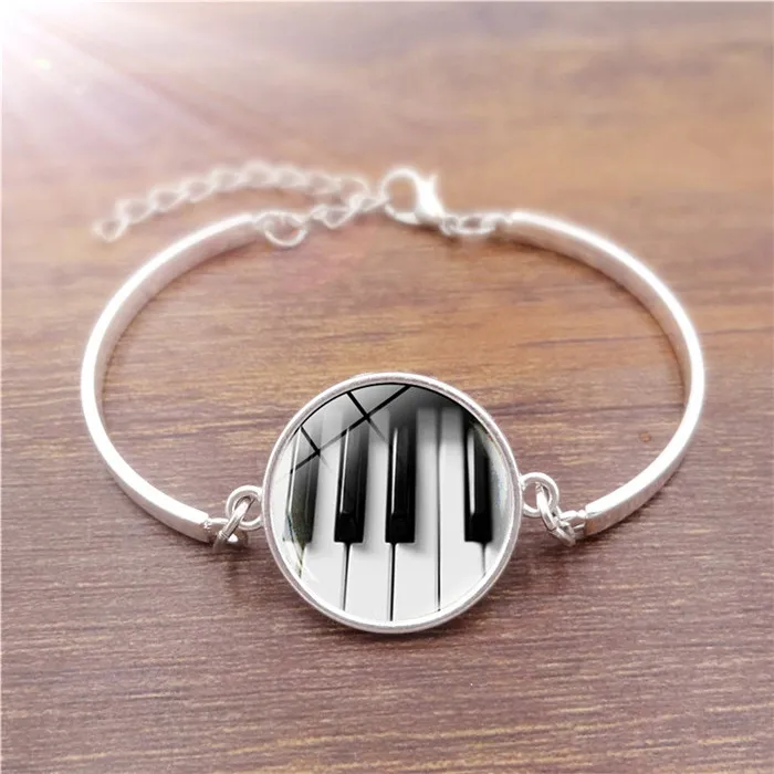 Caldo! 5 pezzi di gioielli in stile popolare con bracciale in argento placcato in vetro cabochon con motivo a pianoforte per regalo da donna