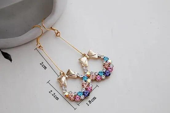 Personlighet Mode Smycken Örhängen Rhinestone Wreath Bowknot Stud Alloy Örhängen för Kvinna