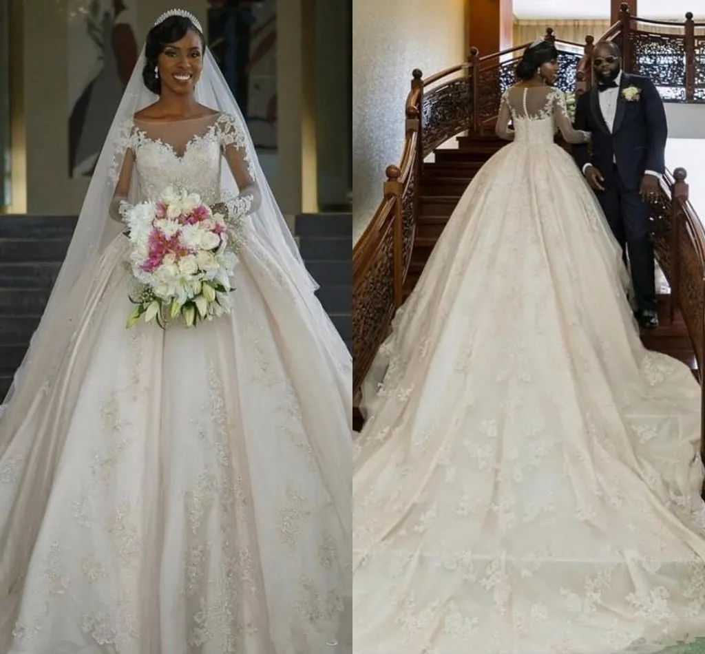 2017 Sexy New Ball Gown Wedding Dresses Jewel Neck Long Sleeves Lace Appliques Beaded Puffy Chapel Train Sheer Back Plus Size Bridal Gowns