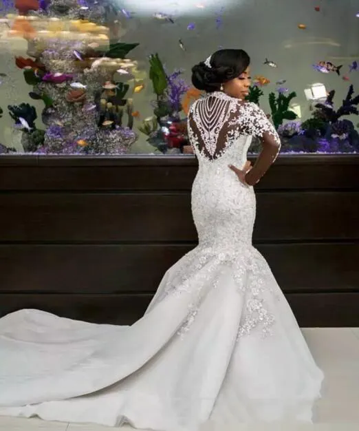 Vestidos de novia de lujo africanos 2018 Apliques de encaje Rebordear Vestidos de novia de cuello alto Mangas largas transparentes Sirena Vestidos de boda Tren de barrido