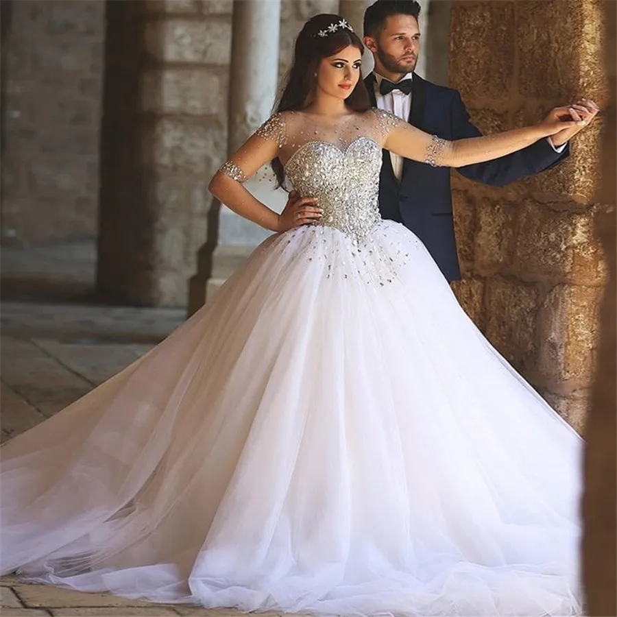 Elegant Scoop Neck Rhinestone Wedding Dresses with Nude Sleeves and Bling Bling Crystal Sweep Train