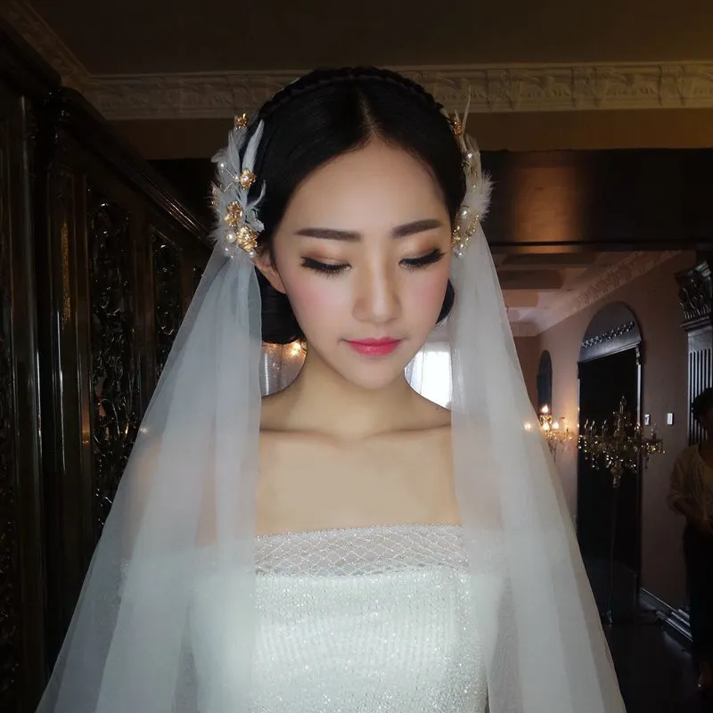 結婚式の結婚式のヘッドピースのための羽毛のヘッドピースのための真珠のヘッドドレス