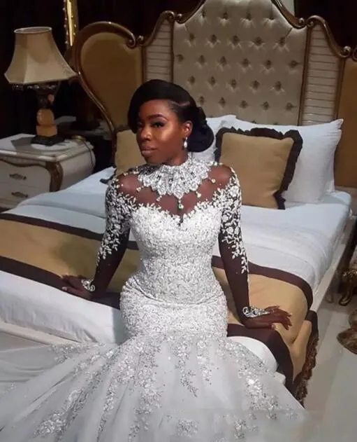 Vestidos de novia de lujo africanos 2018 Apliques de encaje Rebordear Vestidos de novia de cuello alto Mangas largas transparentes Sirena Vestidos de boda Tren de barrido