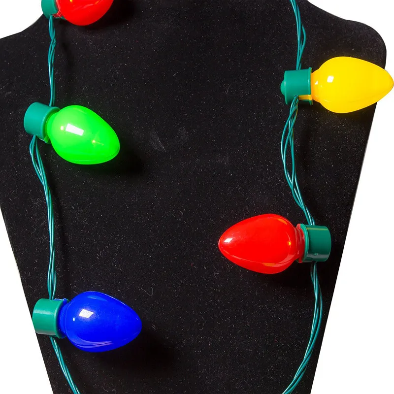O partido da colar do Natal ilumina acima favores de partido do bulbo para adultos ou crianças como um presente do ano novo
