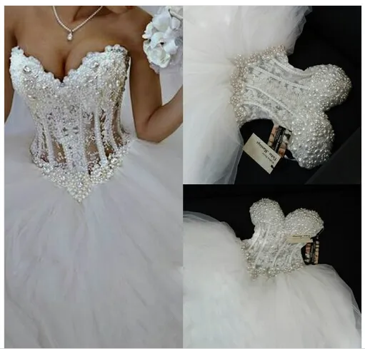 2016 Custom Luxury Crystal Wedding Dresses Sexy Bling Beaded Pearls Embroidery Sweetheart Neck White A Line Backless Corset Bridal Gowns