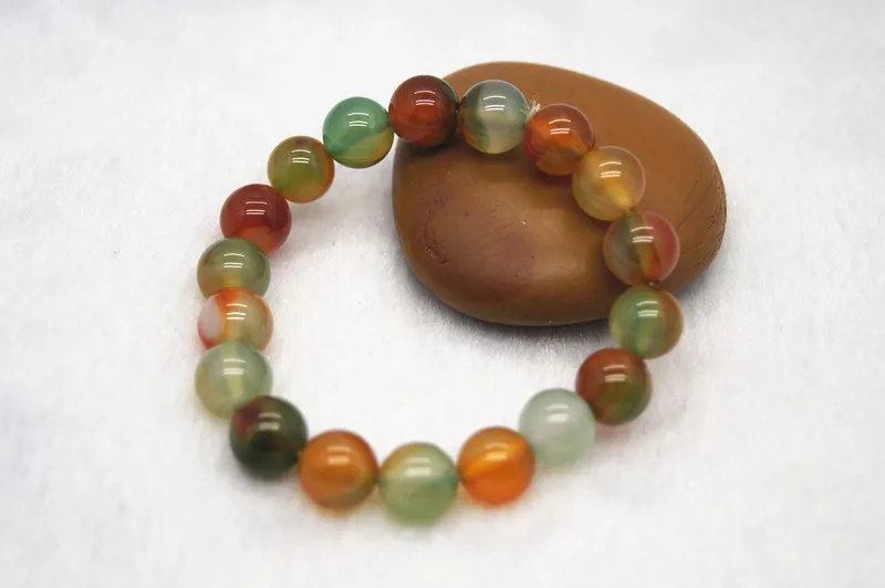 Handmade natural red green jade. 18 round beads. Rubber bands are strung together into attractive bracelets.