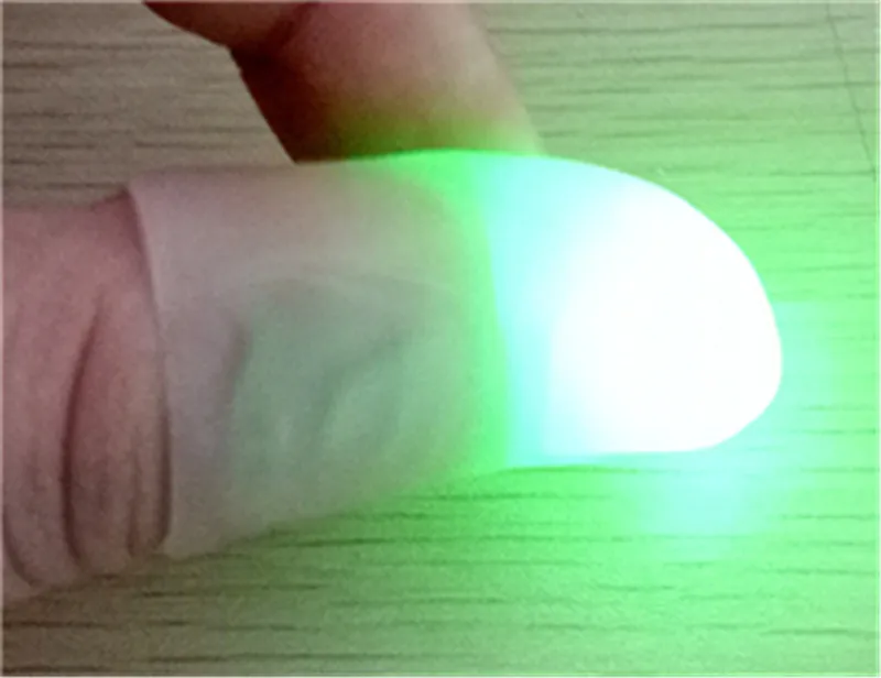 Högkvalitativ ljusa fingerljus tummen Fingrar Magic Light LED Fingers Lamp Toys / T2i136