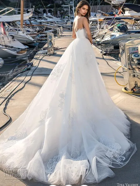 beach wedding dress with detachable skirt Lace Wedding Dress with Long Off-the-Shoulder Sleeves, Slit Skirt & De –  Think Bridal main image 1