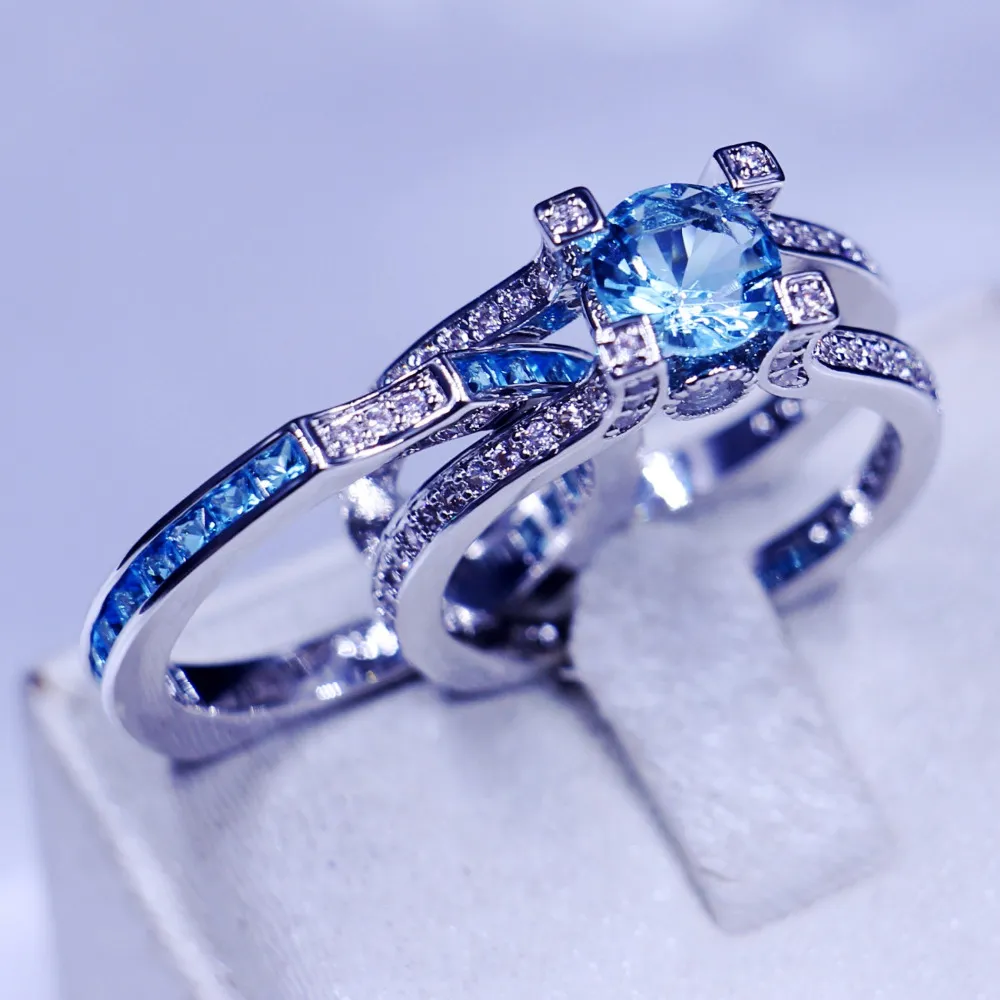 Mode Smycken Bröllop Band Ringar För Kvinnor Män 3ct Sky Blue 5A Zircon CZ 925 Sterling Silver Birthstone Kvinna Ring Set Present