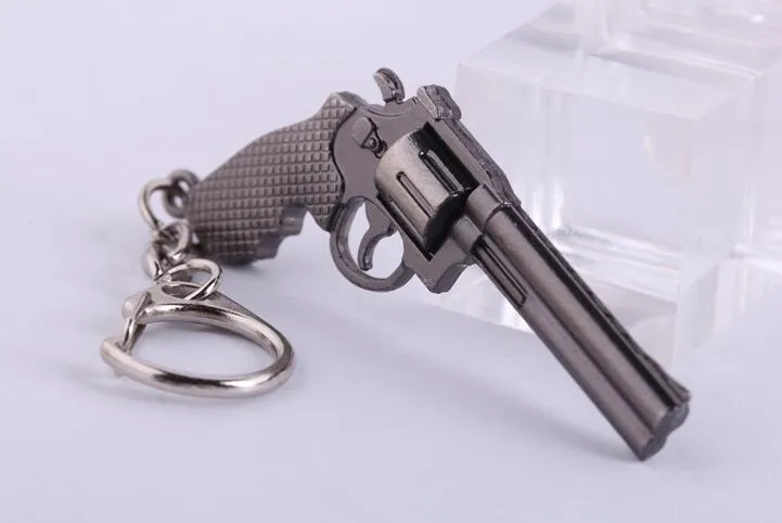 Portachiavi in ​​miniatura da 6 cm con pistola Revolver Pistola Arma modello di moda Portachiavi Portachiavi Nuova mini pistola Portachiavi per gioielli da uomo Regalo a sorpresa