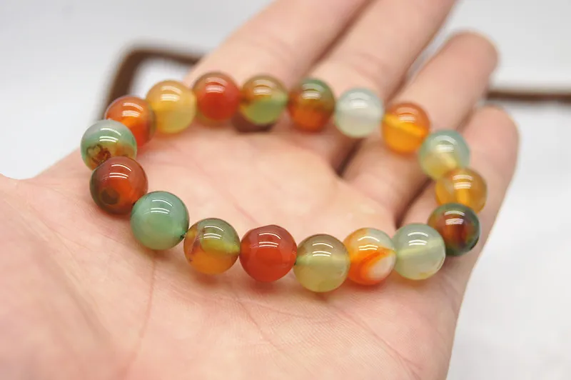 Handmade natural red green jade. 18 round beads. Rubber bands are strung together into attractive bracelets.