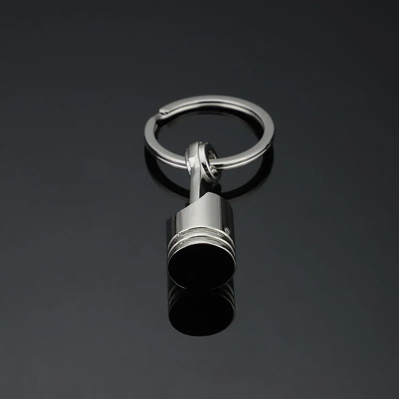 Biegły breloki smycze epackfree 20pcs tłok tłokowy klęcznik kluczyek kluczowy pierścień mody metalowy metalowy tłokowy samochód klęcznikowy klawisz Blak kluczyka