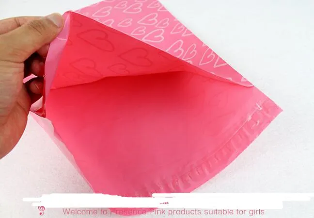 100 sztuk / partia Pink Poly Pe Mailer Express Torba 28 * 42 cm Torby pocztowe Love Heart Envelope Self-Fołu Plastikowe Torby do biżuterii