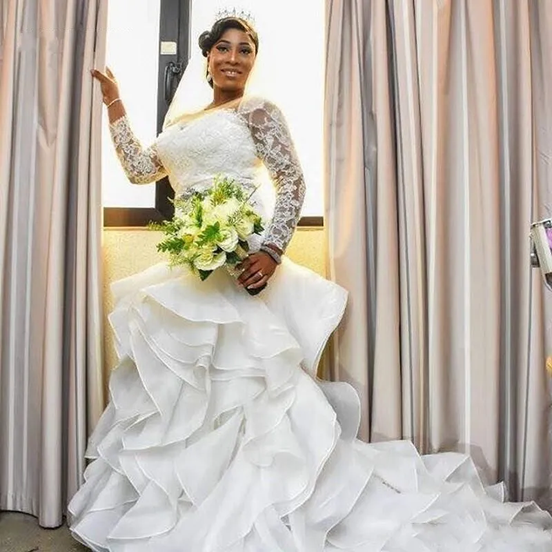 2018 Luxury African Mermaid Wedding Dresses Lace Appliques Long Sleeves Ruffles Tiered Backless Organza Chapel Train Plus Size Bridal Gowns