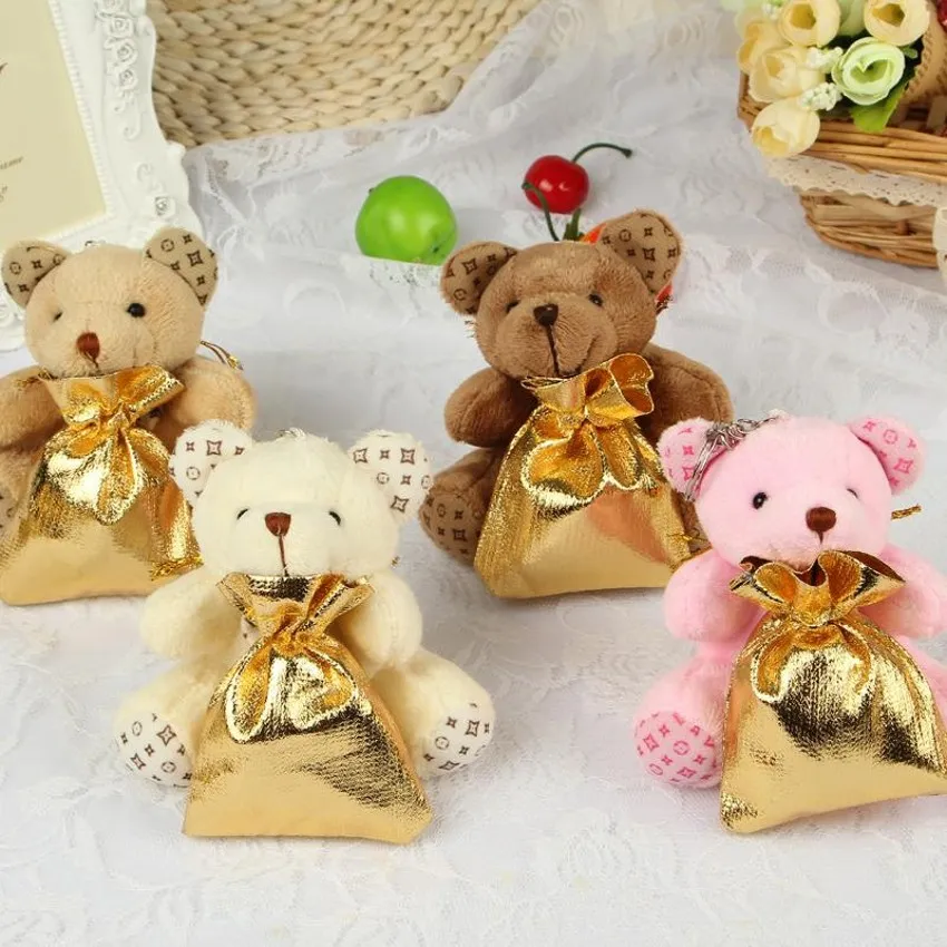 バックパックの結婚式のキャンディーバッグの創造的な小さなクマの赤ちゃんのための結婚式の装飾パーティーの恩恵を提供する