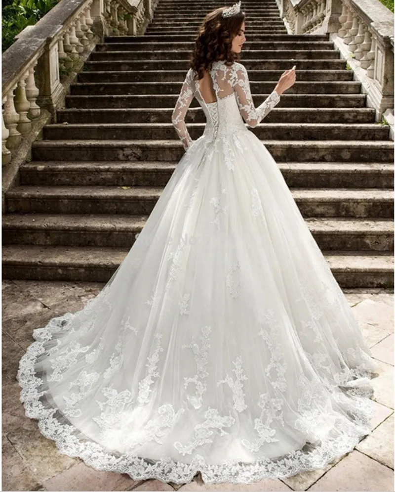 Elegant A Line Wedding with Backless Design, Long Sleeves, Tulle Fabric, Off-Shoulder Appliques, and Court Train - 2024 Collection Elegant A Line Wedding with Backless Design, Long Sleeves, Tulle Fabric, Off-Shoulder Appliques, and Court Train - 2024 Collection