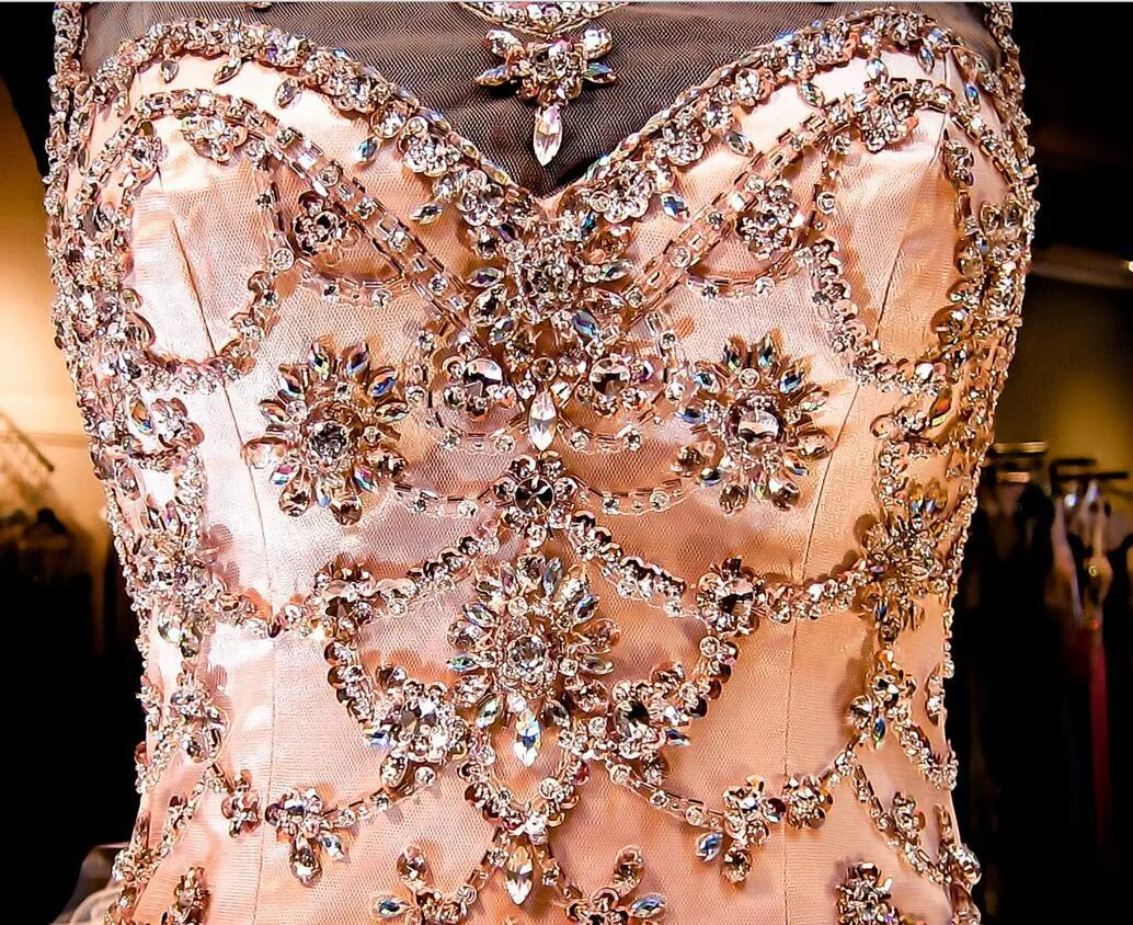 Coral Peach Sheer Crystal Beaded Green Rhinestone Bag Ruffled Tulle Gown with Lace-Up Back and Quinceanera-Inspired Charm