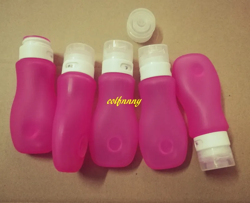 100 stks / partij 89 ml reizen navulbare flessen roze siliconen huidverzorging lotion shampoo gel squeeze fles buis containers met sucker