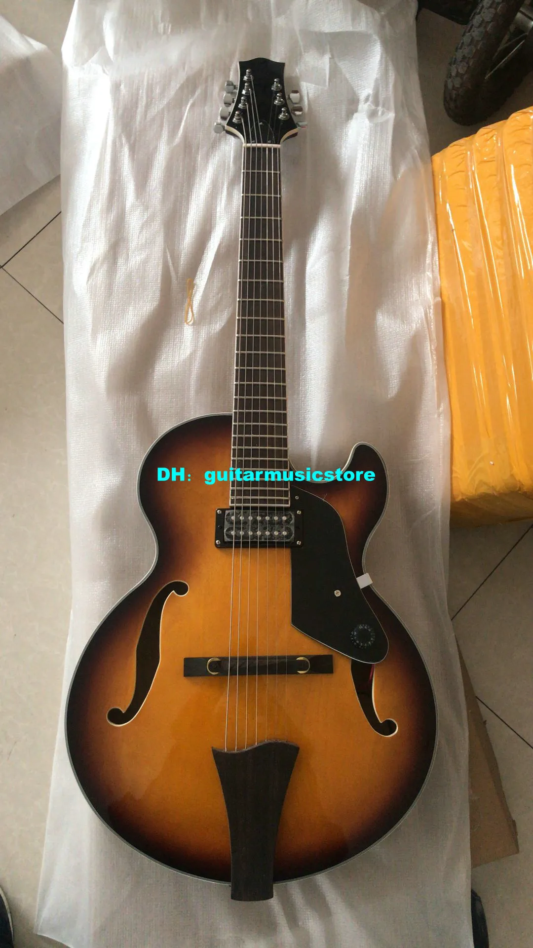 Another inexpensive Chinese 7 string archtop Has anyone dealt with DHgate
