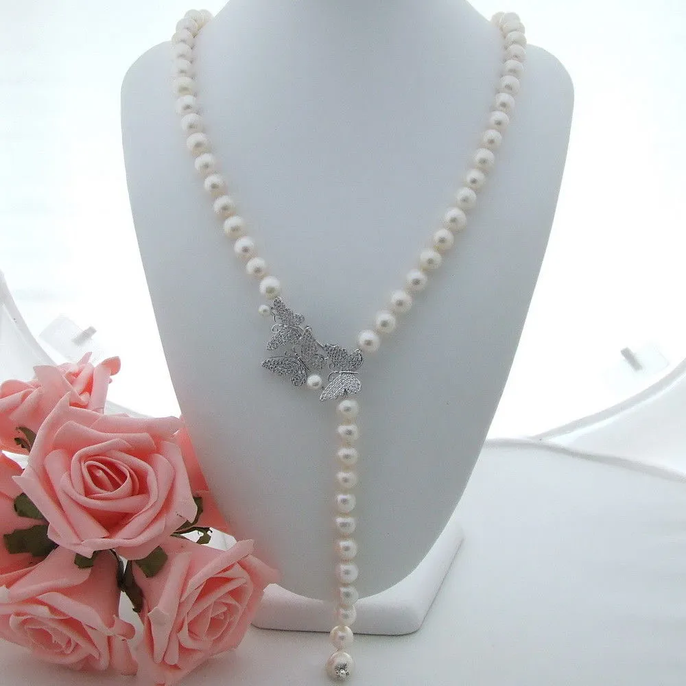 手の結び目の天然の8-9mmの白い淡水真珠のネックレスジルコンの蝶のバックルの花のアクセサリータッセルペンダントファッションジュエリー