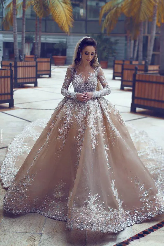 Brillant lourd perles robes de mariée col transparent champagne robe de bal robes de mariée illusion manches longues sirène robes de mariée sur mesure