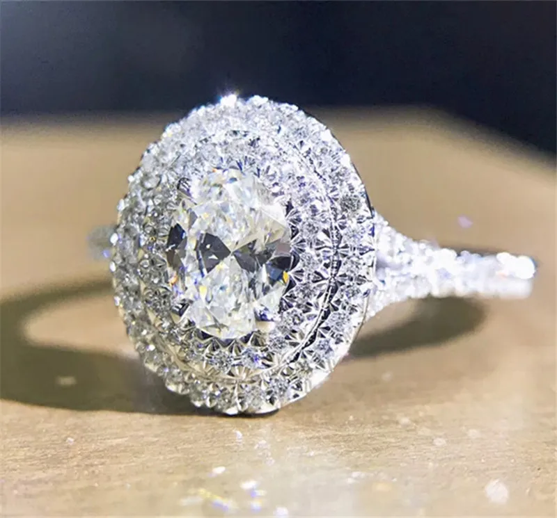 手作りの女性100％Soild 925スターリングシルバーリングオーバルカット0.6ct SONA 5A CZの婚約の結婚式のバンドリング女性ジュエリー