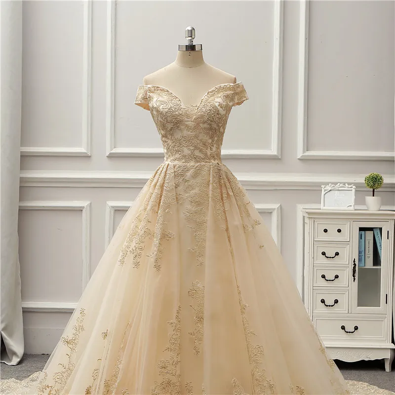 Abiti da sposa champagne con spalle scoperte con ricami Abiti da sposa fantasia a trapezio Abiti da sposa su misura con lacci sul retro