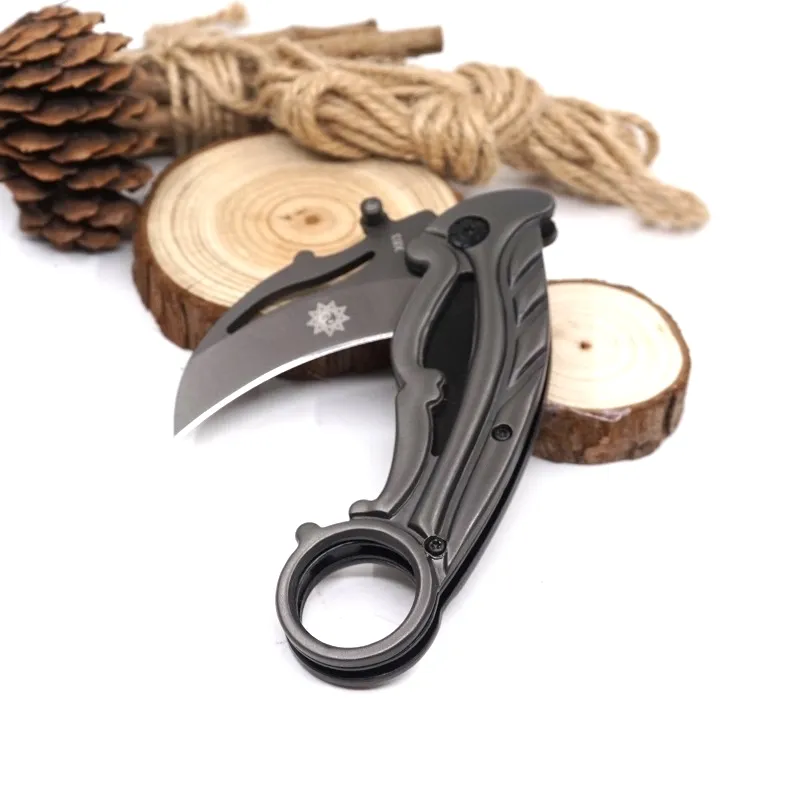 Bästa Karambit X63 Claw Kniv Folding Training Jakt Kniv Utomhus Survival Kniv Handverktyg med Retail Box