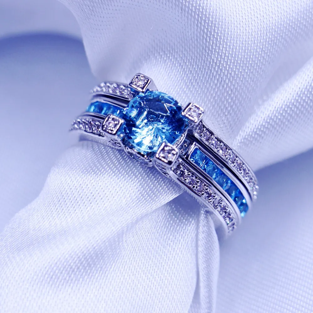 Mode Smycken Bröllop Band Ringar För Kvinnor Män 3ct Sky Blue 5A Zircon CZ 925 Sterling Silver Birthstone Kvinna Ring Set Present