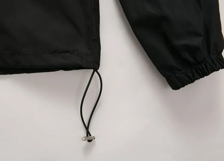 Veste coupe-vent en nylon à capuche Col tricoté Poches zippées Poignet élastique Ourlet réglable Vêtements d'extérieur légers