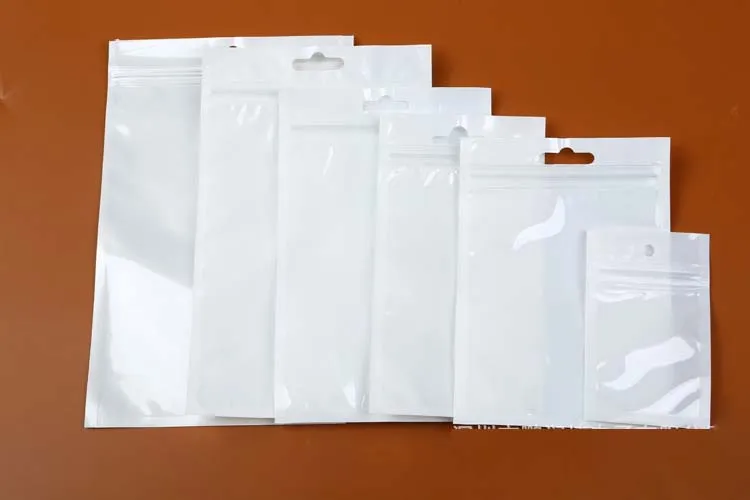 12 * 20cm CLEAR + Vit Pearl Plastväska Poly Opp-paket Zipper Zip Självtätning PVC Retail Packaging Väskor Smycken Mat USB-kabel Telefonväska 10 * 18cm