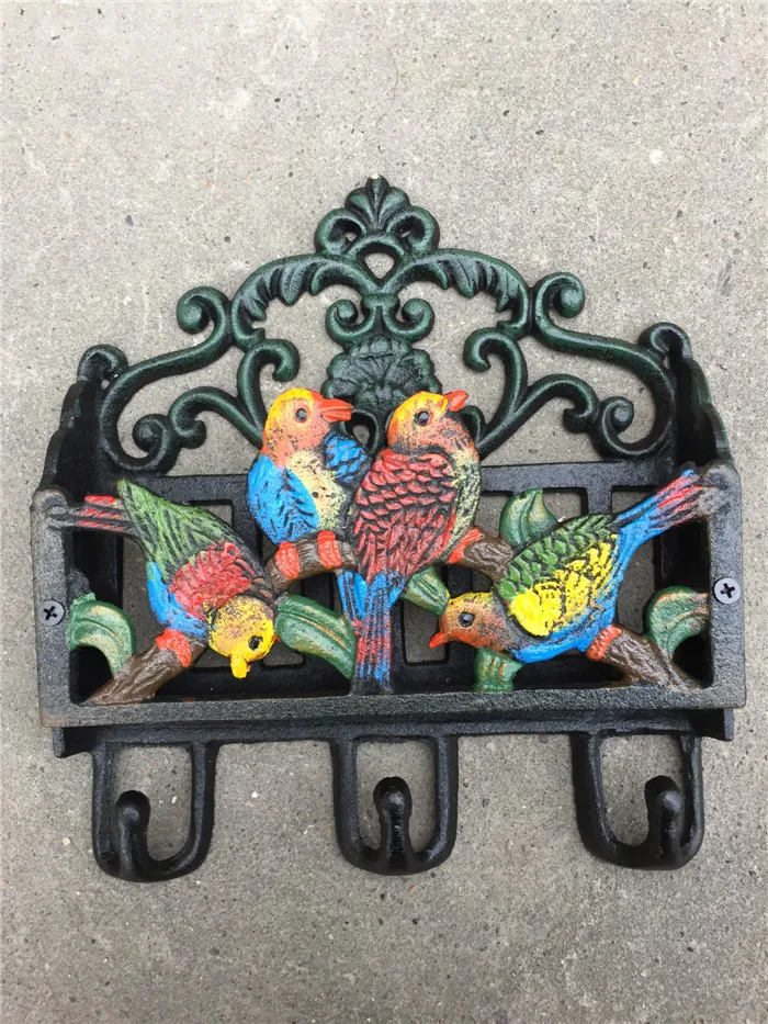Antyczne wiktoriańskie żelazo pomalowane ptaki z szafką na ścianę szelfowa ścienna poczta klucz stojak 3 haczyki