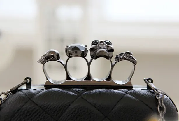 Brass knuckle clutch purse deals